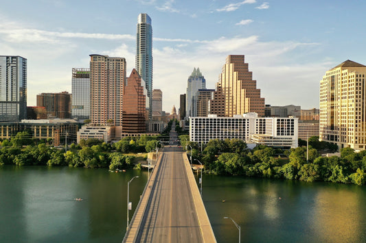 A bridge over a river leading to the downtown skyline of Austin, Texas