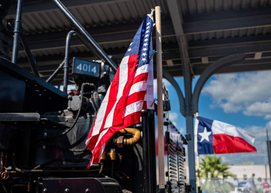 A tractor with an american flag on the side of it